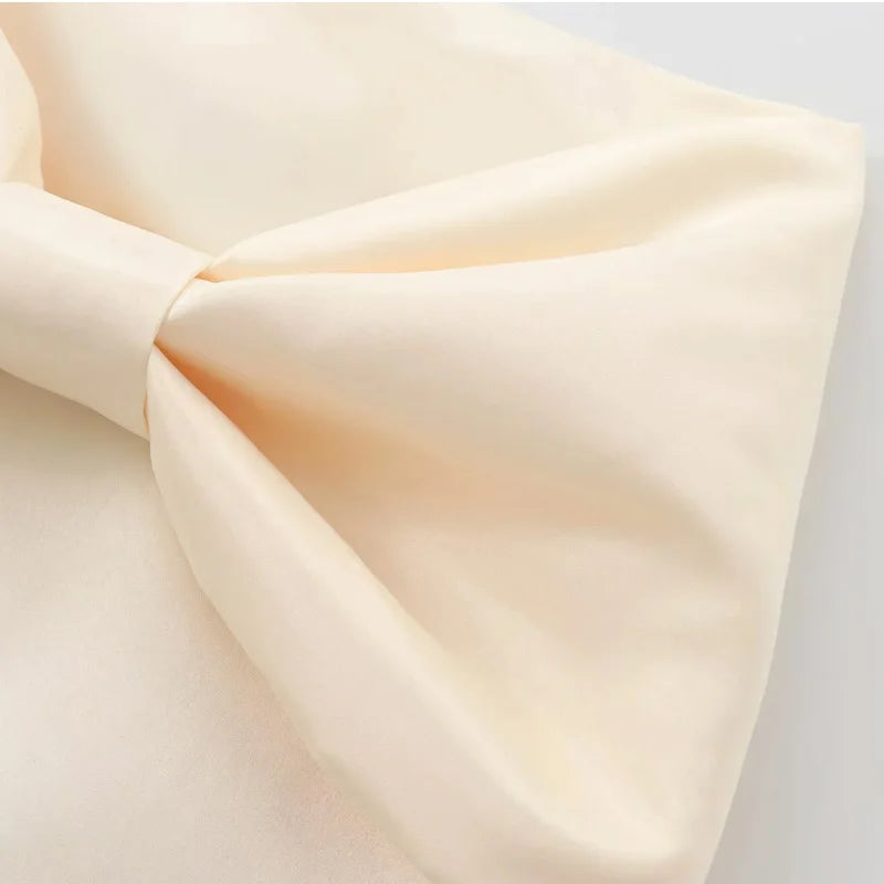 SATIN BOW PLEATED MINI SKIRT