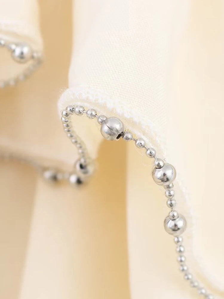 CHIC RUFFLED MINI SKIRT – PEARL EMBELLISHED