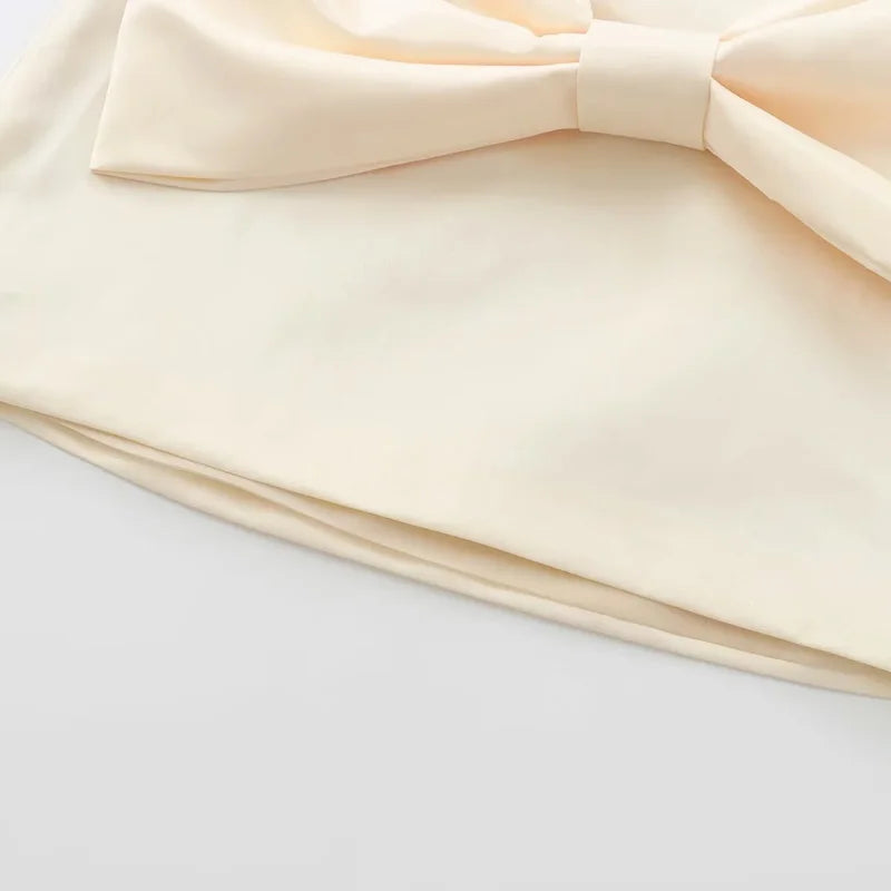 SATIN BOW PLEATED MINI SKIRT