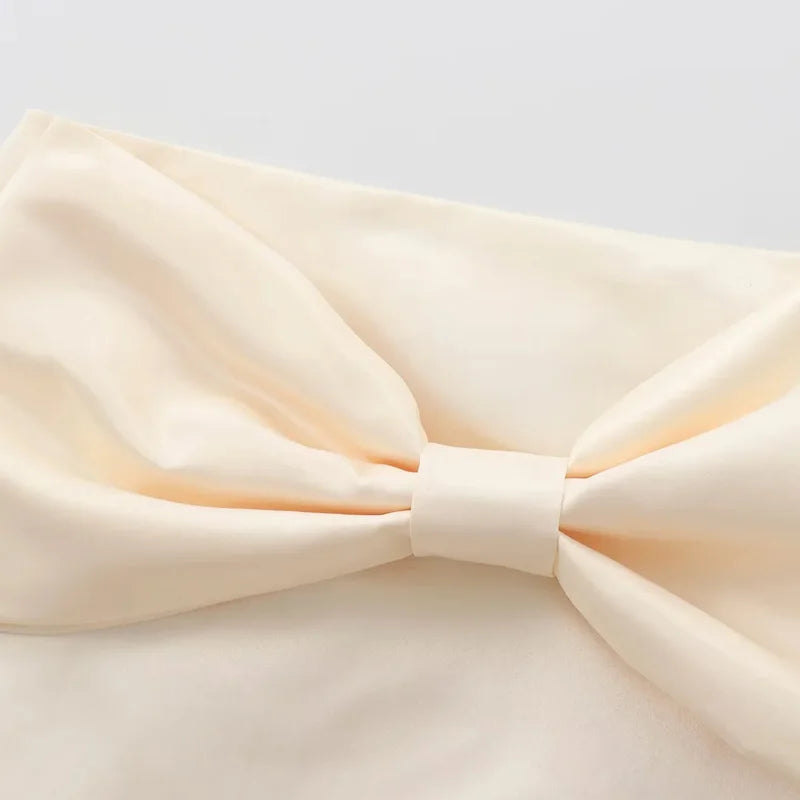SATIN BOW PLEATED MINI SKIRT